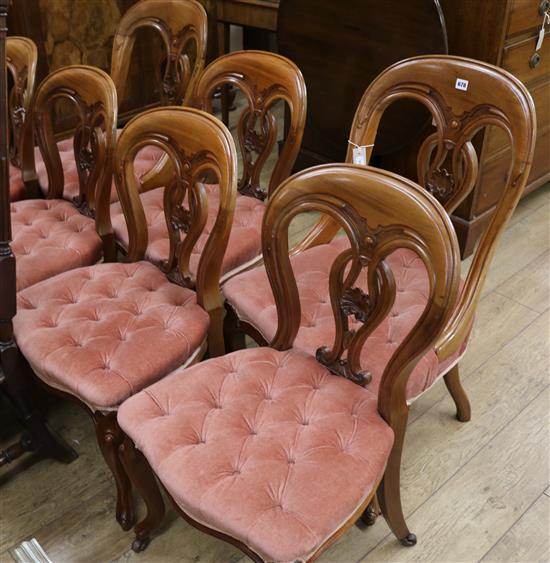 A matched set of seven Victorian carved mahogany spoon back dining chairs (5 plus 2)